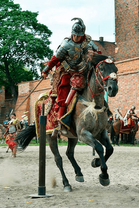 Mounted knight in armour at a tournament